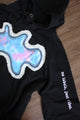 black hoodie with colourful front design, soft white fabric, pretty blue, blue and purple tie-dye, repurposed in canada