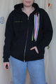 upcycled black zip up hoodie with colourful fabric stripes on the front, repurposed in canada