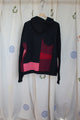 black upcycled hoodie, with patchwork design and pops of pink, cream and red, repurposed in canada