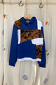 upcycled patchwork hoodie, repurposed in canada featuring blues, bleached and white sweaters