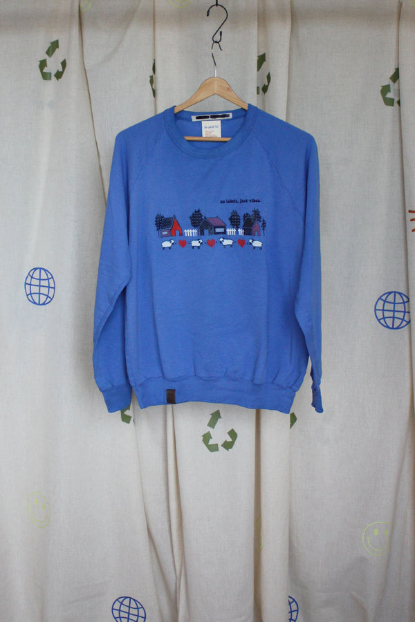 periwinkle upcycled grandma sweater with hearts, sheep and house motif on front, repurposed in canada