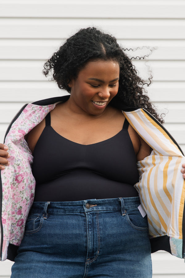 one of a kind bomber jacket, made from quilt scraps, beautiful pastels and vibrant pink sleeves, repurposed in canada