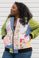 one of a kind bomber jacket made with quilt scraps, super colourful and fun prints, with vibrant green sleeves, repurposed in canada size medium