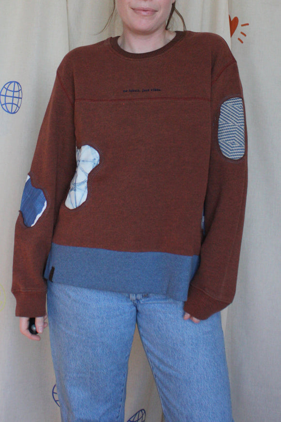 brown and blue upcycled sweater with pops of blue and blue patterns, repurposed in canada