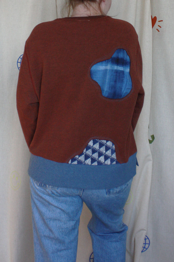 brown and blue upcycled sweater with pops of blue and blue patterns, repurposed in canada