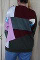 patchwork sweater with green pinks, purples, blues and cranberry colours, repurposed in canada