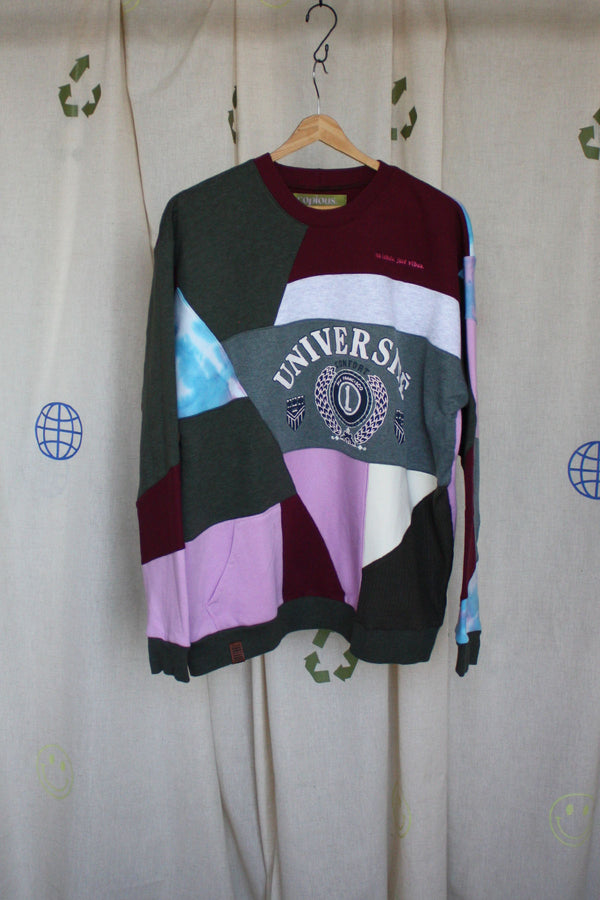 patchwork sweater with green pinks, purples, blues and cranberry colours, repurposed in canada