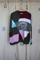 patchwork sweater with green pinks, purples, blues and cranberry colours, repurposed in canada