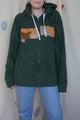 green upcycled hoodie with faux leather scraps sewn on front, with tan and camel colours and a suede butterfly on the front and back, repurposed in canada