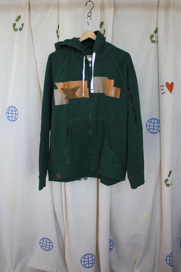 green upcycled hoodie with faux leather scraps sewn on front, with tan and camel colours and a suede butterfly on the front and back, repurposed in canada