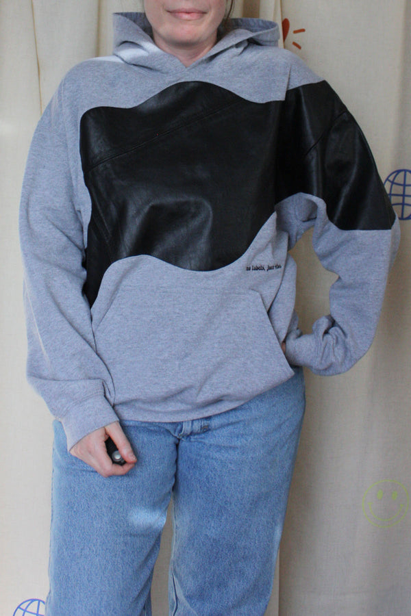 grey upcycled hoodie with black leather detailing, repurposed in canada