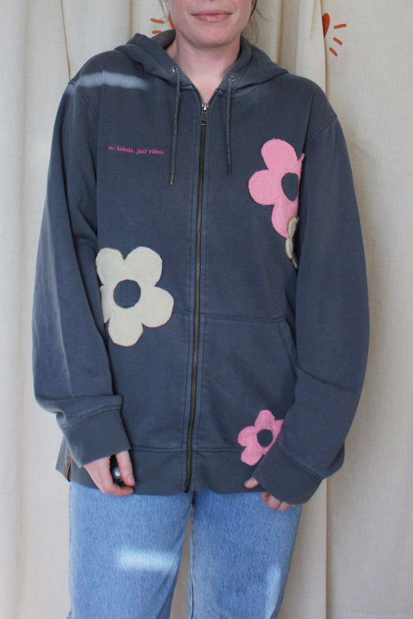 slate grey upcycled hoodie with pink and cream flowers throughout, repurposed in canada