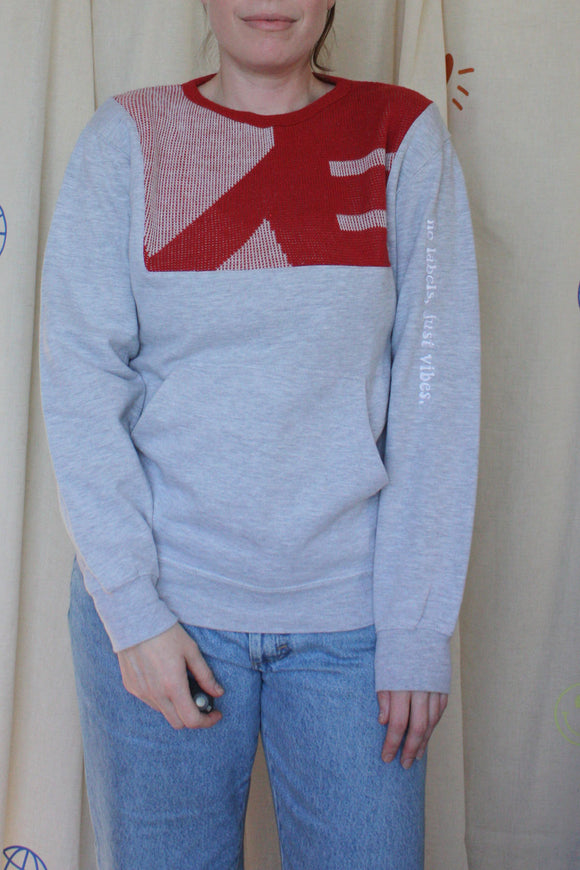 grey upcycled sweater with red gaphic, repurposed in canada