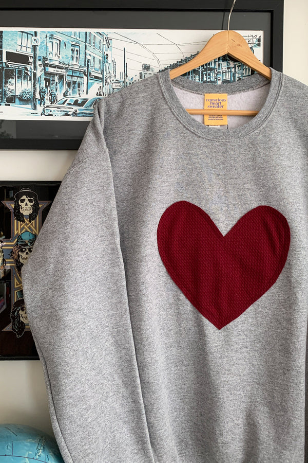 heather grey oversized sweater with cranberry heart applique, upcycled fabric, recycled fabric, handstitched in Ottawa