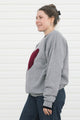 heather grey oversized sweater with cranberry heart applique, upcycled fabric, recycled fabric, handstitched in Ottawa