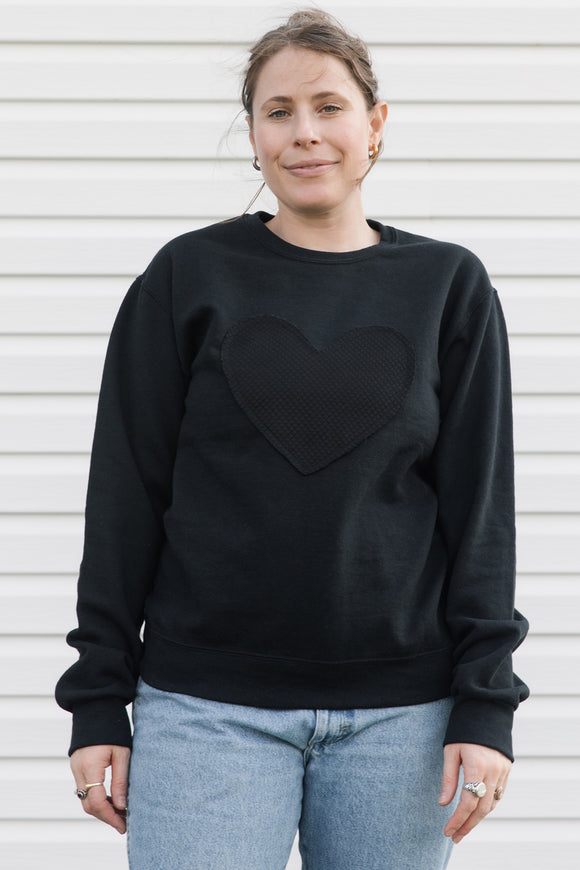 unisex black sweater with black quilted heart, upcycled in canada