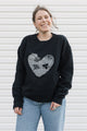 grey heart with floral design on black sweater, unisex and oversized fit, hand sewn in canada