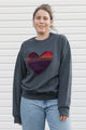 Indigenous woven heart sewn onto charcoal sweater, unisex and oversized fit, sewn in Canada