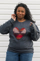 Indigenous woven heart sewn onto charcoal sweater, unisex and oversized fit, sewn in Canada