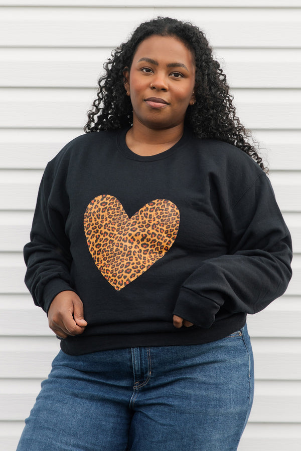 faux leather leopard print heart on a black sweater, unisex and oversized, sewn in canada