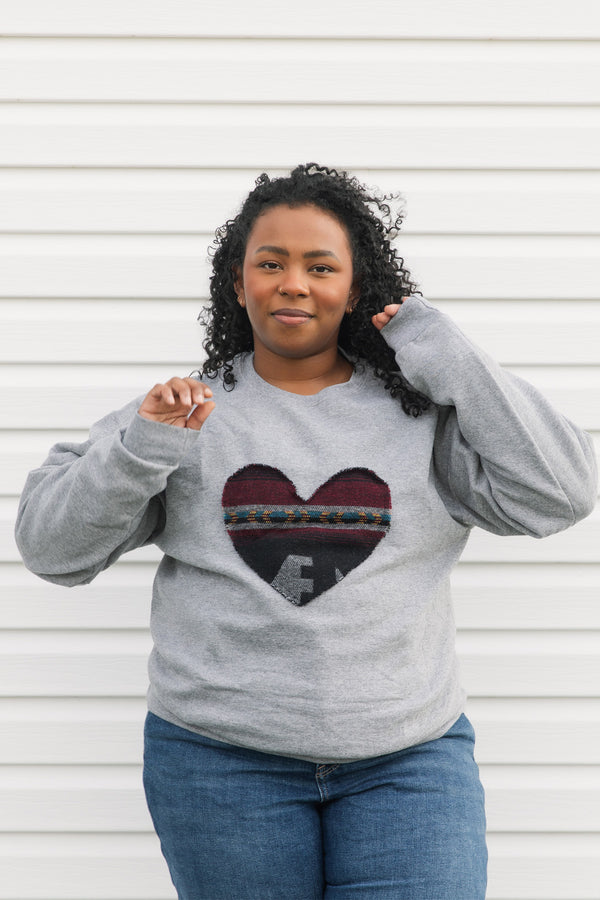 Indigenous printed heart sewn on heather grey sweater, unisex and oversized fit, sewn in canada