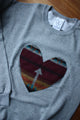 Indigenous printed heart sewn on heather grey sweater, unisex and oversized fit, sewn in canada