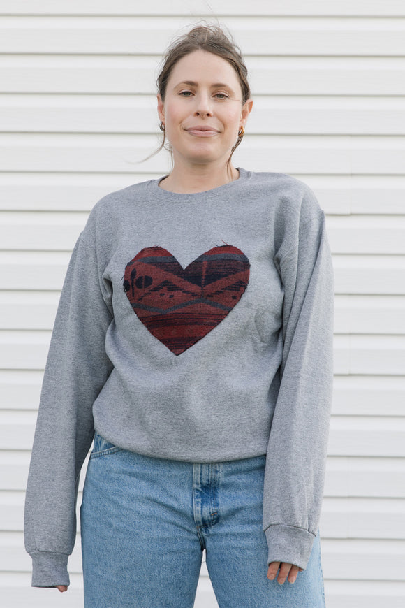 Indigenous printed heart sewn on heather grey sweater, unisex and oversized fit, sewn in canada