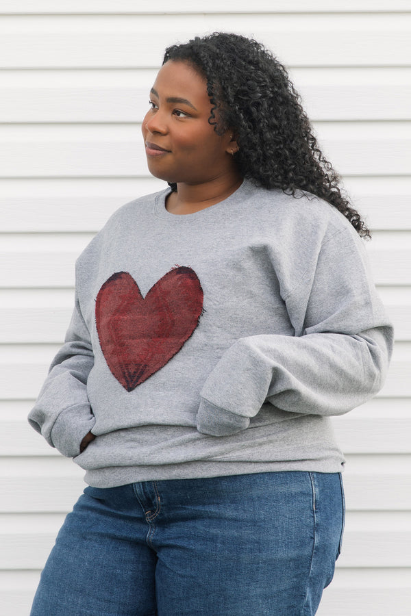 Indigenous printed heart sewn on heather grey sweater, unisex and oversized fit, sewn in canada