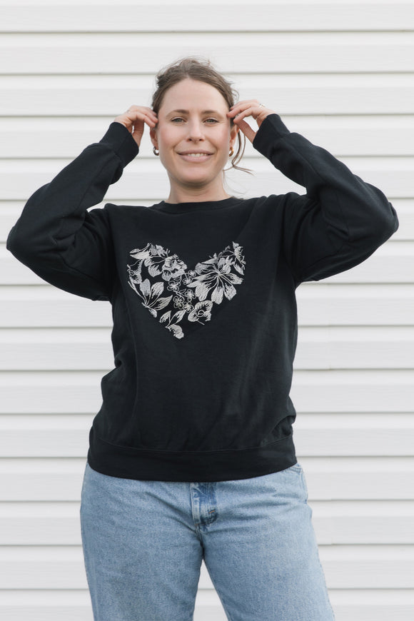 silver floral lace heart sewn on black sweater, unisex and oversized fit, sewn in canada