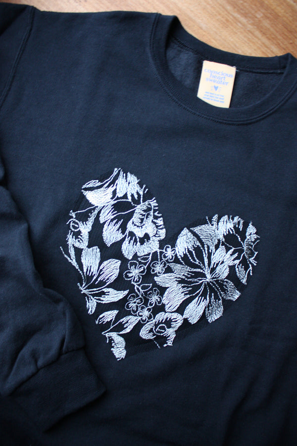 silver floral lace heart sewn on black sweater, unisex and oversized fit, sewn in canada