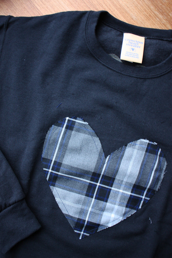 blue plaid heart sewn on black sweater, unisex and oversized fit, sewn in canada