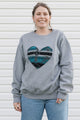 Indigenous woven blue heart sewn on heather grey sweater, unisex and oversized fit, sewn in canada