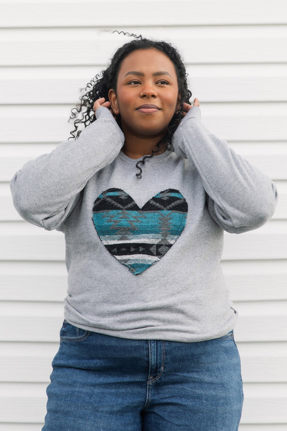 Indigenous woven blue heart sewn on heather grey sweater, unisex and oversized fit, sewn in canada