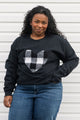 white plaid heart sewn on black sweater, unisex and oversized fit, sewn in canada