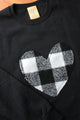 white plaid heart sewn on black sweater, unisex and oversized fit, sewn in canada