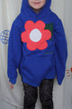 blue upcycled sweater worn by 5 year old, features coral flower with leaves on it, upcycled in canada