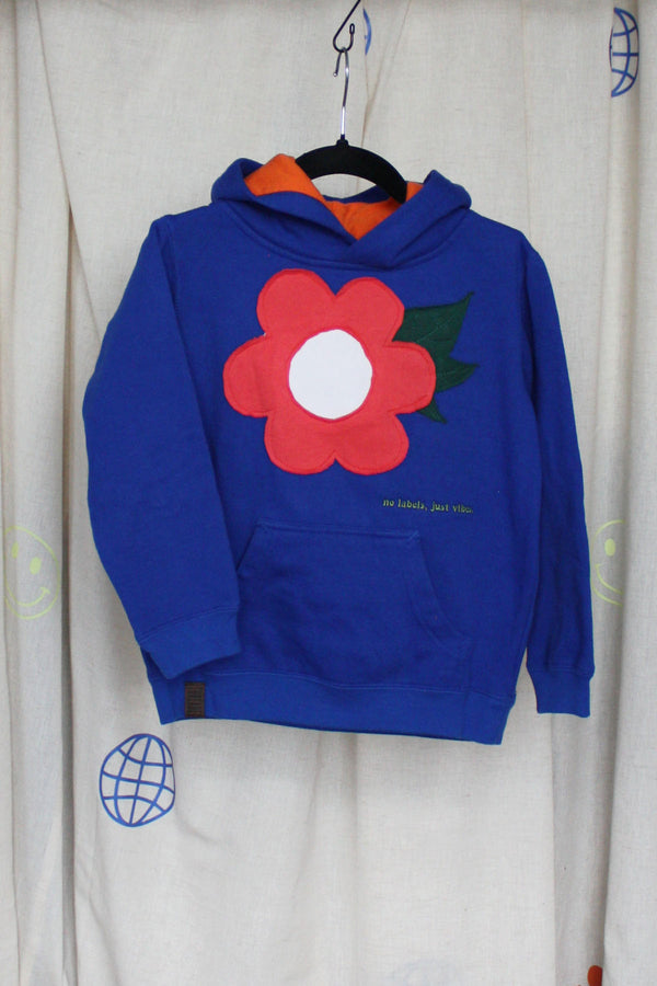 blue upcycled sweater worn by 5 year old, features coral flower with leaves on it, upcycled in canada