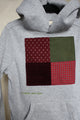 grey upcycled hoodie wrong by 6 year old, features maroon, green and red patterned squares, repurposed in canada