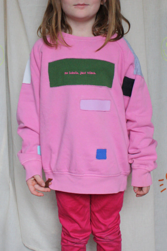 kids pink upcycled crewneck worn by 6 years, with pops of colour, repurposed in canada