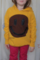 yellow upcycled hoodie worn by 6 year old, brown smiley face repurposed in canada