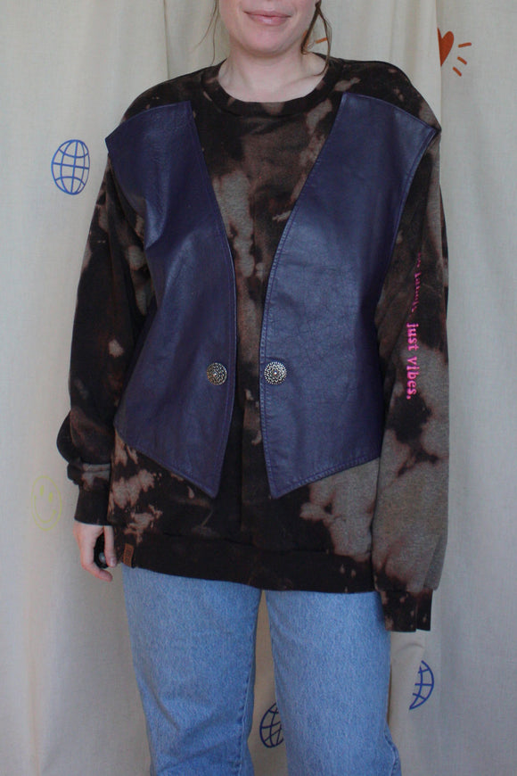 black bleached sweater with purple vest sewn on the front, upcycled in canada