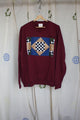 maroon upcycled sweater with geometric motif on the front, repurposed in canada