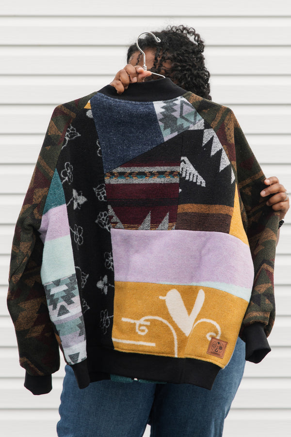 upcycled bomber jacket using mini tipi blanket material, lots of unique patterns and colours, repurposed in canada