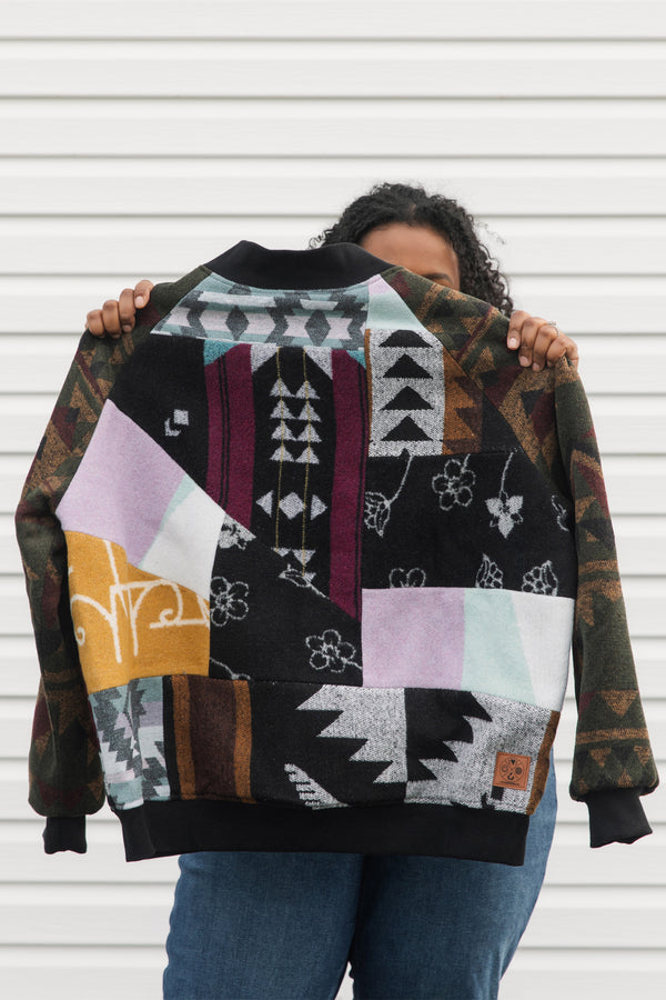 upcycled bomber jacket using mini tipi blanket material, lots of unique patterns and colours, repurposed in canada