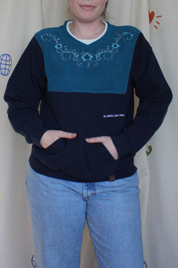 teal and navy upcycled sweater with kangaroo pocket, repurposed in canada