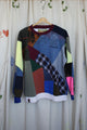 patchwork sweater made from scrap fabric, repurposed secondhand clothing, circular fashion