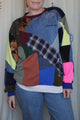 patchwork sweater made from scrap fabric, repurposed secondhand clothing, circular fashion