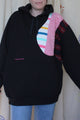 upcycled black hoodie with colourful front and back, repurposed in canada