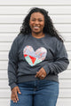 one of a kind quilted heart stitched on a charcoal sweater, unisex and oversized fit, hand cut and sewn in canada