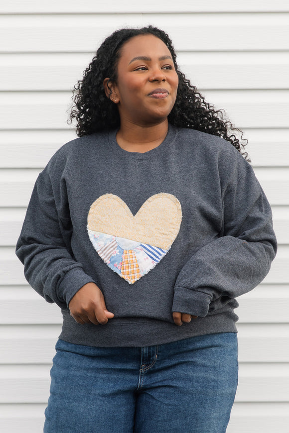 one of a kind quilted heart sewn on charcoal sweaters, unisex and oversized fit, hand cut and sewn in canada